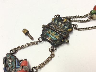 Lot 536 - Chinese white metal enamelled panel necklace, the top panel suspended with coral teardrop bead, the lower panel with three chains terminated with turquoise, green hard stone and carnelian beads. Th...