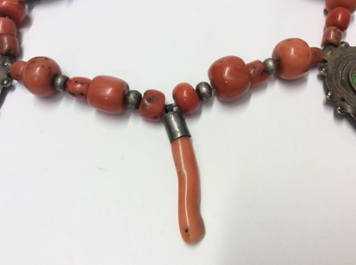 Lot 537 - Old Chinese coral bead necklace with four white metal enamelled disc pendants, and one other coral bead necklace with white metal bead decoration