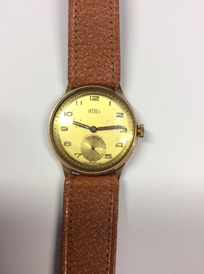 Lot 541 - Trebex 9ct gold cased wristwatch with gold coloured face, Arabic numerals and subsidiary seconds dial, on brown leather strap