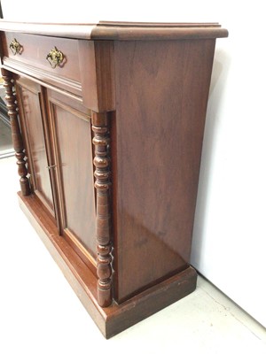 Lot 128 - Victorian mahogany chiffonier with drawer and cupboard below enclosed by two panelled doors flanked by turned columns on plinth base, 92cm wide x 37cm deep x 85cm high