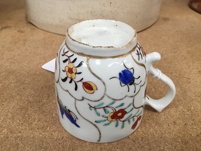 Lot 53 - Lowestoft coffee cup and tea bowl, painted with various insects and flower sprigs within gilded compartments, and a Worcester coffee cup of the same pattern (3)