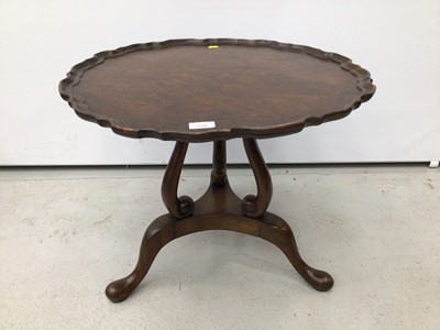 Lot 134 - Georgian style burr walnut finished coffee table with piecrust top on three scroll supports with three hipped splayed legs terminating on pad feet, 60cm wide x 49cm high