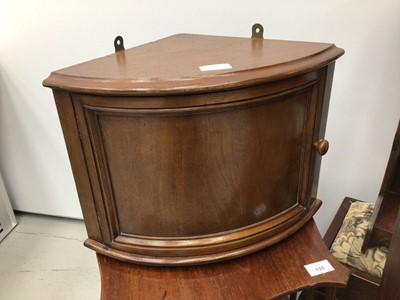 Lot 135 - Small group of furniture to include an Edwardian walnut desk-top revolving bookcase, 34cm high x 37cm square, two mahogany wall mounted cupboards, two Victorian hanging shelves and two footstools