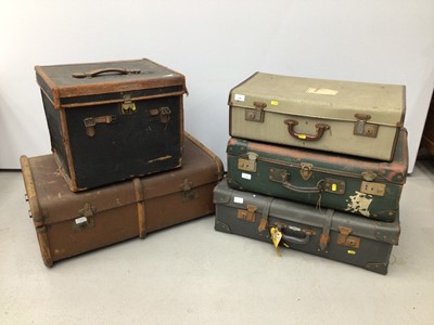 Lot 136 - Three vintage suitcases and two vintage cabin trunks, together with vintage tennis racquets