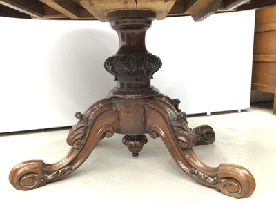 Lot 143 - Nineteenth century rosewood oval tilt top loo table on carved turned column and four carved splayed legs with scroll feet, 130cm x 99cm x 67cm high and a set of four dining chairs