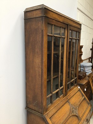 Lot 148 - 1920's oak bureau bookcase with glazed doors above standing on barley twist legs H195cm W90cm D45cm