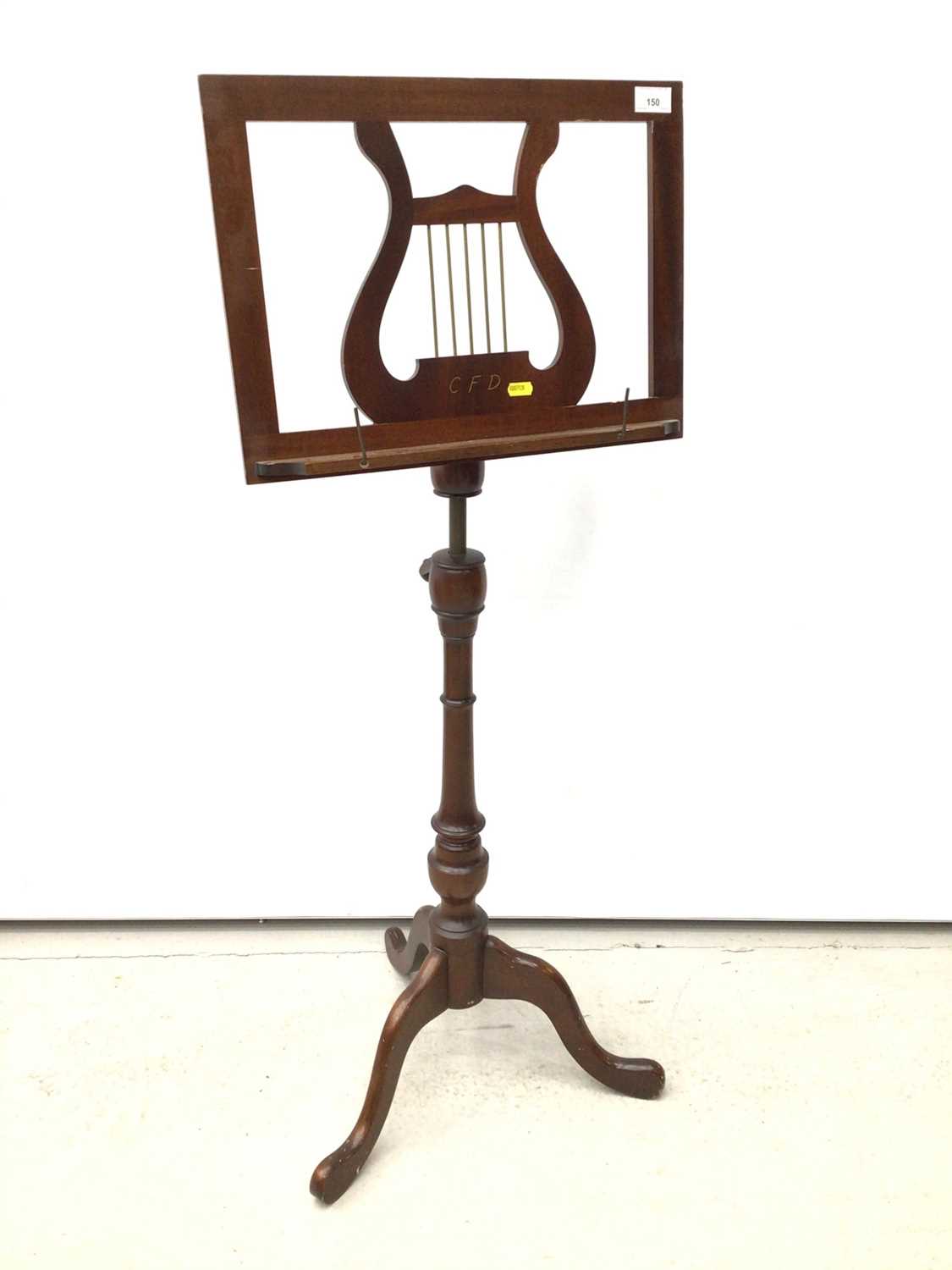 Lot 150 - Georgian style mahogany music stand with lyre motif, adjustable height, on turned column and tripod base