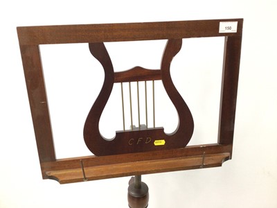 Lot 150 - Georgian style mahogany music stand with lyre motif, adjustable height, on turned column and tripod base
