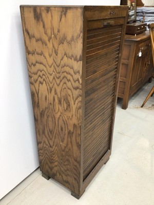 Lot 156 - 1930's oak filing cabinet with pull out sliding trays enclosed by tambour shutter, with lock and key, 47cm wide, 114cm high, 36cm deep