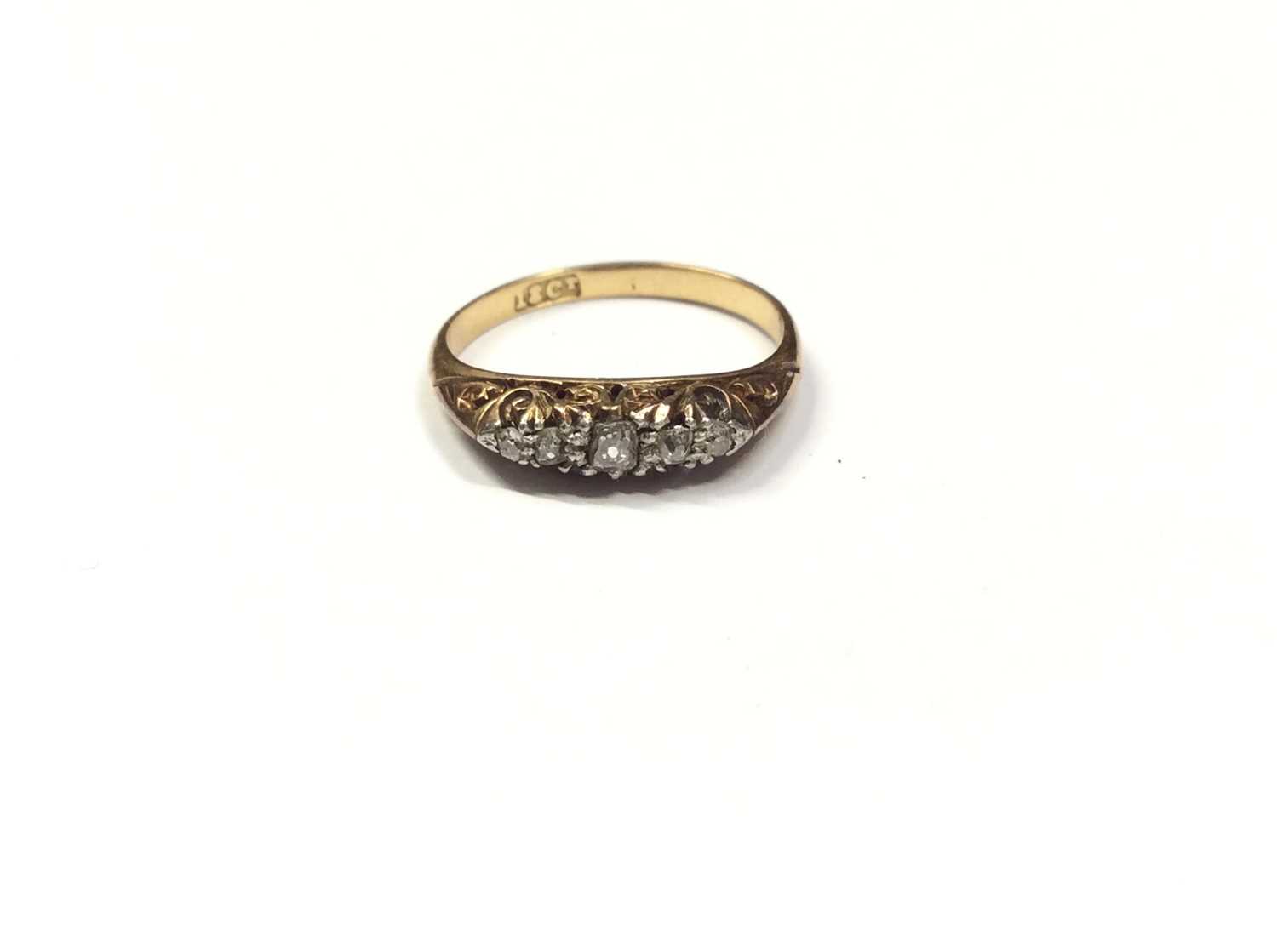 Lot 546 - Late Victorian diamond five stone ring with five graduated old cut diamonds in carved gold claw setting on 18ct gold shank. Ring size K