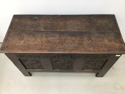 Lot 159 - Late seventeenth century carved and panelled oak coffer with candle box interior enclosed by hinged lid with original link and staple hinges, the front with carved frieze and three carved panels, 1...