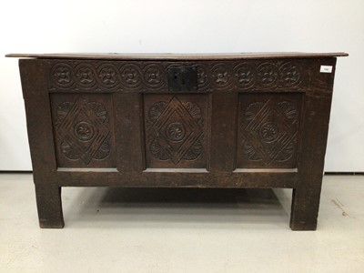 Lot 159 - Late seventeenth century carved and panelled oak coffer with candle box interior enclosed by hinged lid with original link and staple hinges, the front with carved frieze and three carved panels, 1...