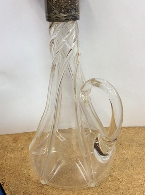 Lot 15 - Silver mounted tapered glass spirit decanter, together with a silver gilt mounted glass scent bottle (2)