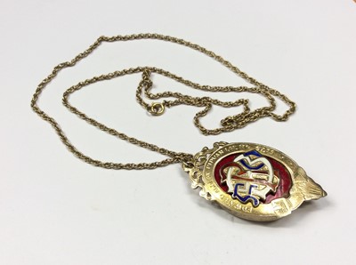 Lot 551 - Silver gilt Masonic enamelled locket pendant with presentation inscription on reverse, on gold chain