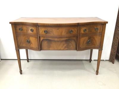 Lot 81 - George III style mahogany serpentine front sideboard