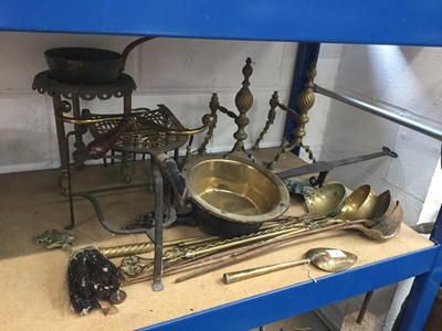 Lot 26 - Pair of antique brass fire dogs, together with brass trivets and a group of copper and brass ladles and utensils (qty)