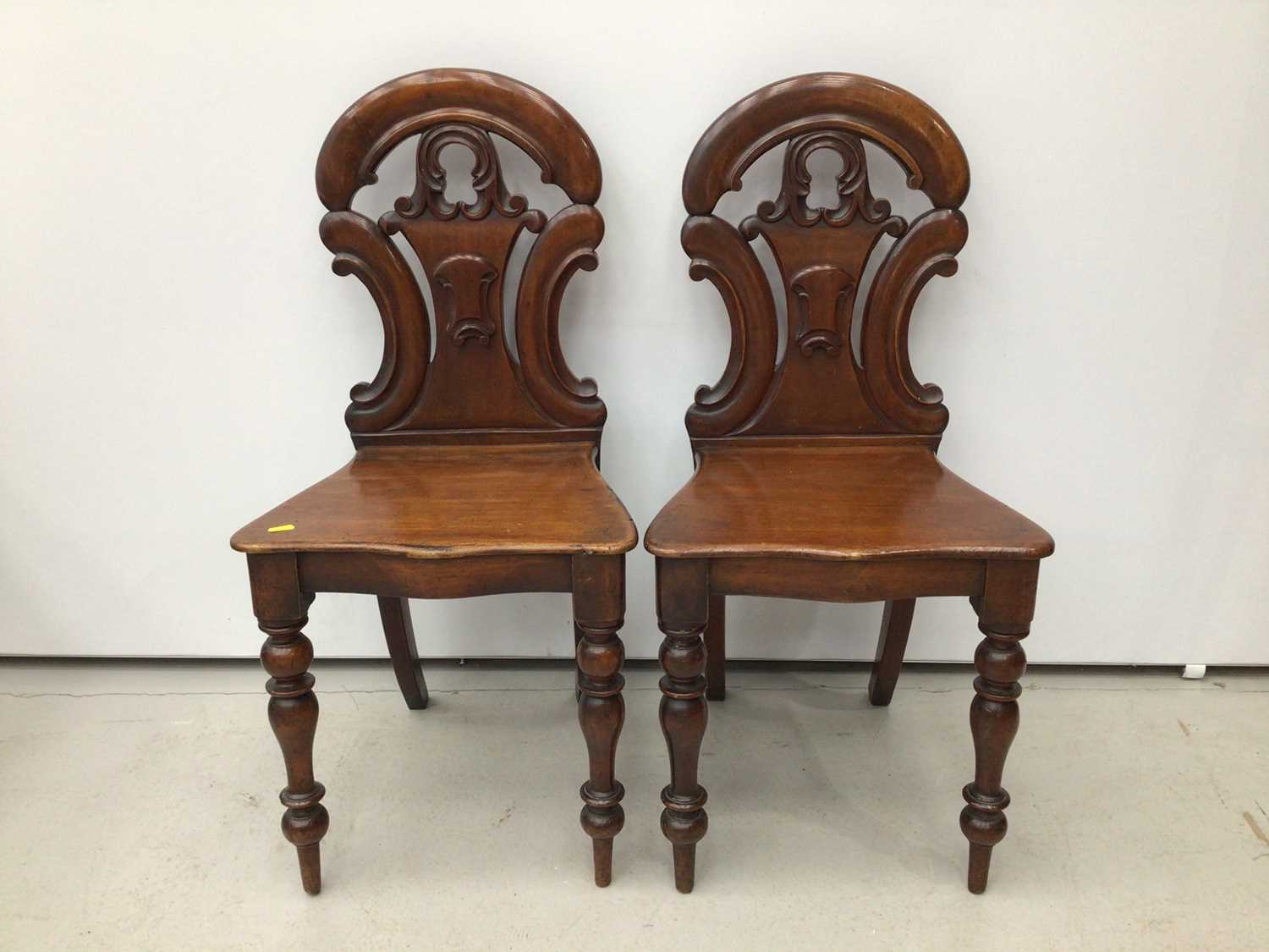 Lot 118 - Pair of early Victorian mahogany hall chairs