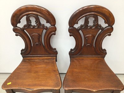 Lot 91 - Pair of early Victorian mahogany hall chairs