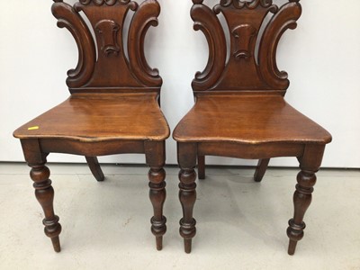 Lot 91 - Pair of early Victorian mahogany hall chairs