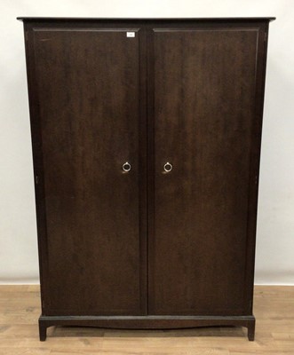 Lot 175 - Stag Minstrel bedroom suite comprising two double wardrobes, chest of three short and four long drawers, pair of single drawer bedside tables and a dressing table with triple mirror back and five d...