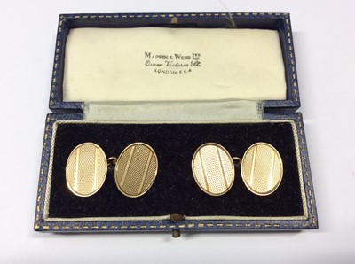 Lot 558 - Pair 9ct gold cufflinks, the oval panels with engine turned decoration, in fitted case