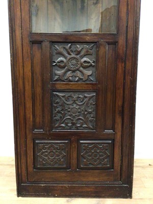 Lot 181 - Old corner cupboard with shelved interior enclosed by glazed and carved panelled door, 65cm wide, 182cm high