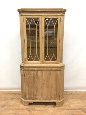 Lot 182 - Limed wood two height corner cupboard with two glazed doors above and cupboards below, 85cm wide, 178cm high