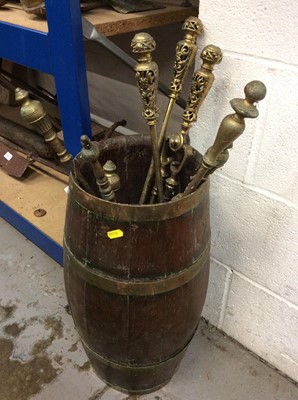 Lot 64 - Brass bound wooden barrel containing various fire irons and implements