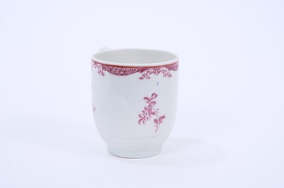 Lot 59 - Rare Lowestoft coffee cup, painted in puce monochrome with flower sprays and sprigs, a red line under the rim and an elaborate puce border below, 6.1cm high
