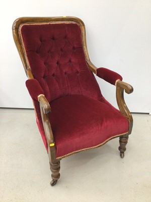 Lot 197 - Victorian mahogany framed open armchair with red buttoned upholstery on turned front legs abd castors