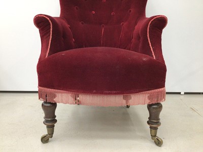 Lot 198 - Victorian spoon back armchair with buttoned red upholstery on turned mahogany front legs and brass capped castors