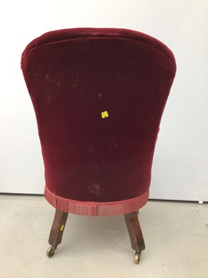 Lot 198 - Victorian spoon back armchair with buttoned red upholstery on turned mahogany front legs and brass capped castors