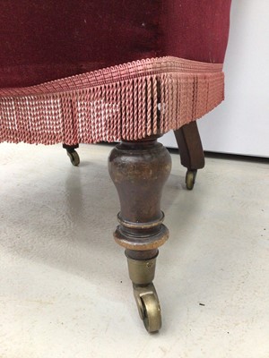 Lot 198 - Victorian spoon back armchair with buttoned red upholstery on turned mahogany front legs and brass capped castors