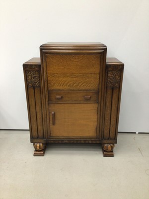 Lot 204 - Carved oak writing cabinet with fall front, single drawer and cupboard below, 91cm wide, 35cm deep, 114cm high