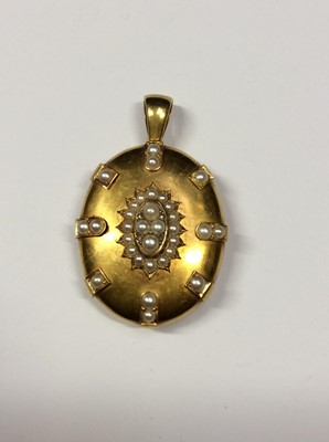 Lot 568 - Victorian yellow metal oval locket set with cultured pearls and four rose cut diamonds. 45mm x 37mm