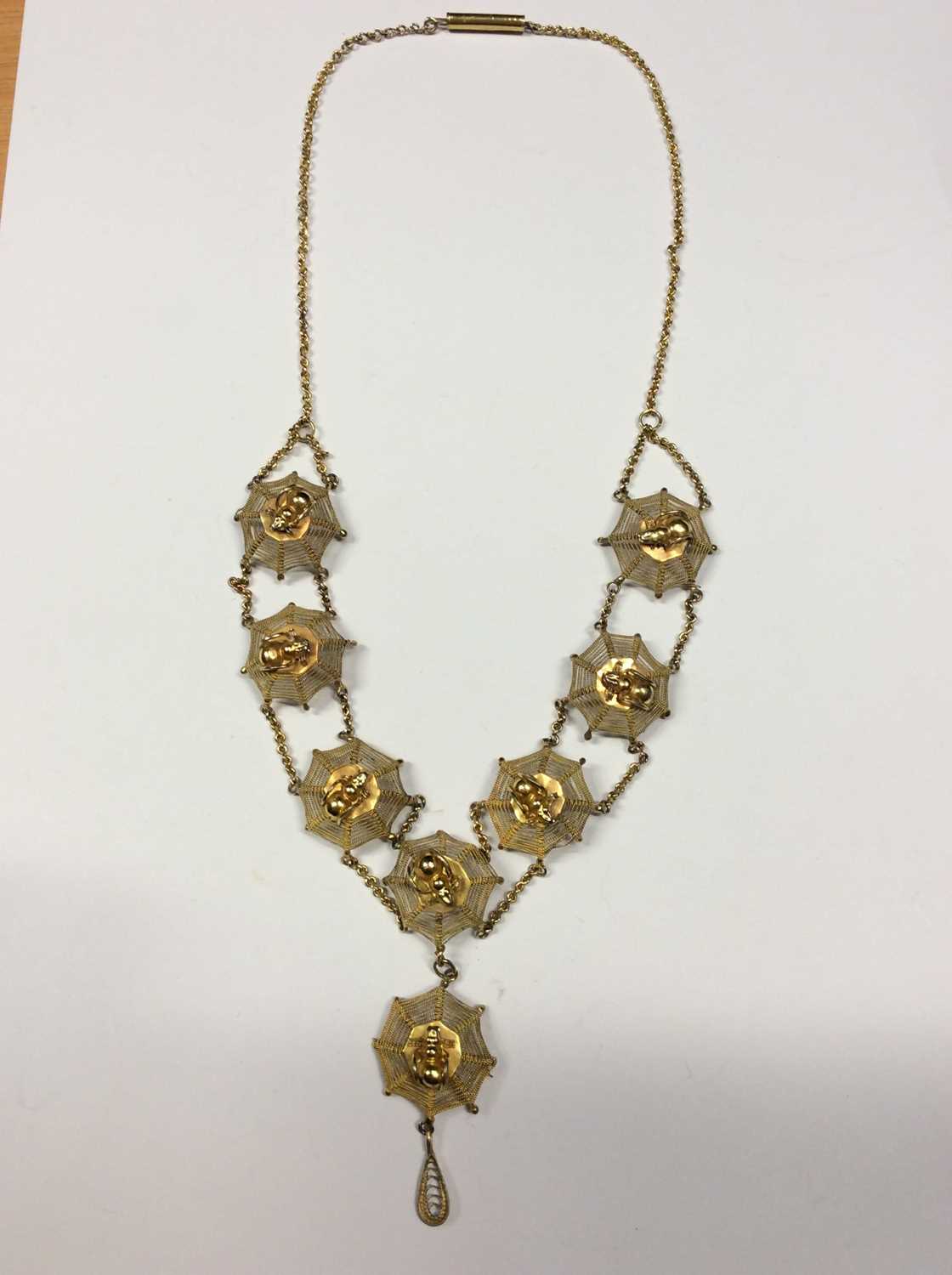 Lot 569 - Gilt metal cobweb and spider necklace, the