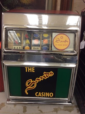 Lot 1110 - Vintage One Arm Bandit Slot machine 'The Sands Casino, Las Vegas', with label on reverse for Hollywood Film Prop Company, approximately 58cm in height