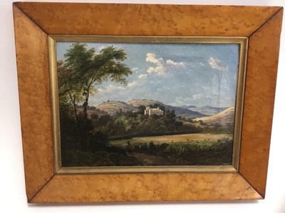 Lot 286 - Mid 19th century oil on canvas, figure in an extensive landscape, 17 x 27cm, in period birds eye maple frame
