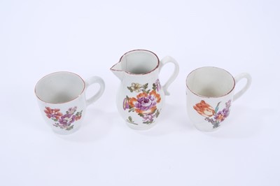 Lot 69 - Lowestoft sparrow beak jug and two coffee cups, all painted in the Tulip Painter style, the jug 8.5cm high