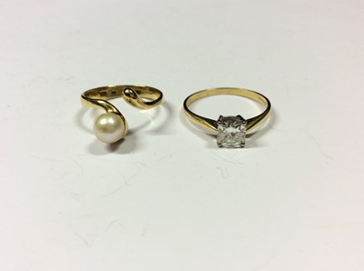 Lot 576 - 18ct gold single cultured pearl wrap around ring, size P and 18ct gold white synthetic cushion cut single stone ring, size T