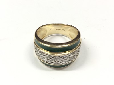 Lot 582 - 9ct gold diamond and green enamel ring