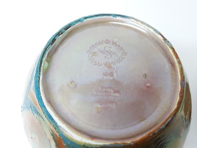 Lot 274 - Pilkington's Royal Lancastrian lustre jar, decorated by William S Mycock with a repeating motif in orange on a bluish green ground, marks to base, 21.5cm height including cover