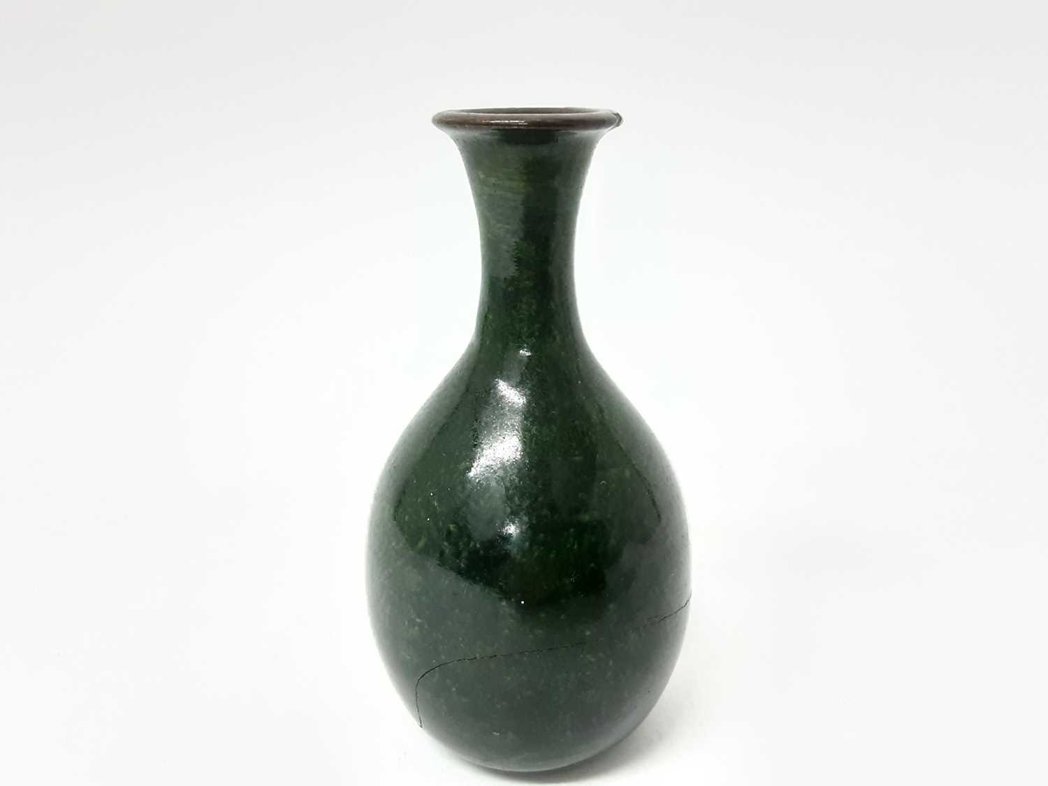 Lot 77 - Martin Brothers stoneware bottle vase, decorated with a mottled green glaze, inscribed mark to base, 12.5cm height