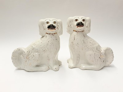 Lot 216 - Two Staffordshire spaniels, 26cm and 25cm