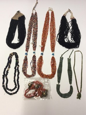 Lot 588 - Two Bondo Tribe micro bead necklaces, other similar style African necklaces and beads