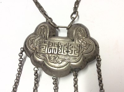 Lot 344 - Old Chinese white metal necklace with embossed panel depicting figures and Chinese characters, with bells on chain