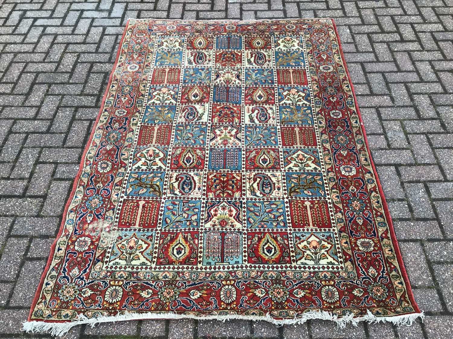 Lot 224 - Eastern rug with geometric decoration on red