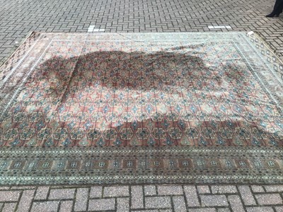 Lot 227 - Large rug with geometric decoration on red and blue ground, 376cm x 198cm