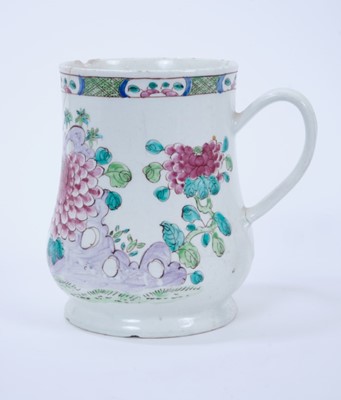 Lot 91 - Large Bow tankard, c.1760, decorated in the famille rose style with flowers, 16cm high