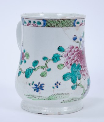 Lot 91 - Large Bow tankard, c.1760, decorated in the famille rose style with flowers, 16cm high